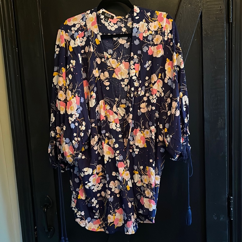 Multi color cover up. Tasseled sleeves.